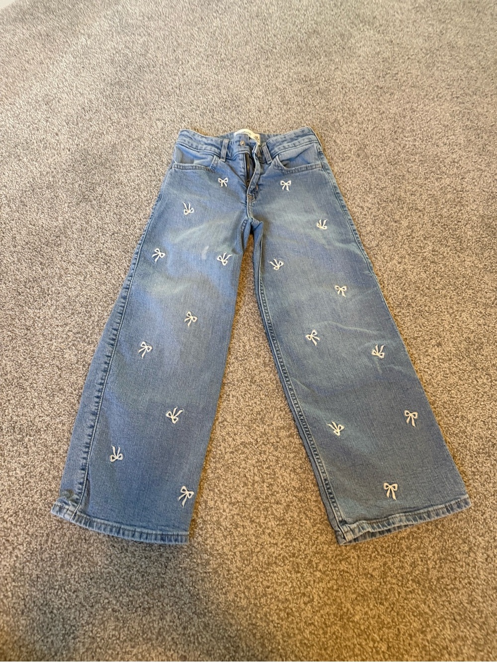 Kids' Light Blue Embroidered Bow Jeans. High rise wide leg regular. 7-8